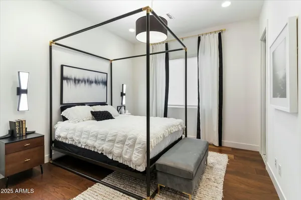 a bedroom with a bed and window