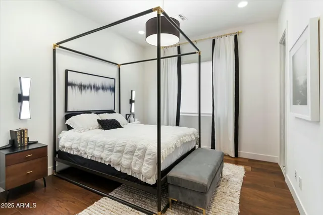 a bedroom with a bed and window