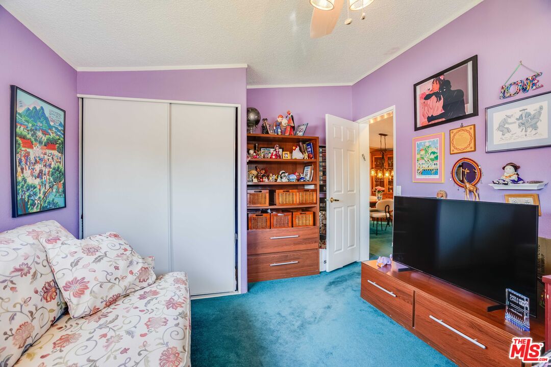 1111 Cherokee Topanga, CA 90290 - Photo 12 of 21 a bedroom with bed and flat screen tv