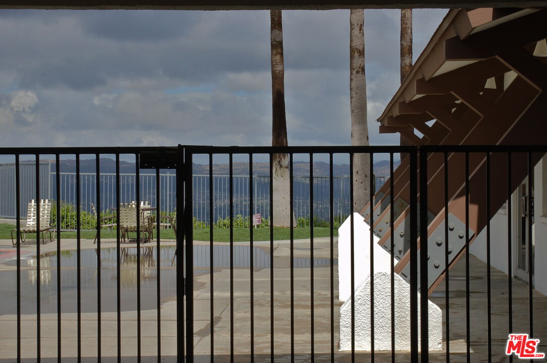 1111 Cherokee Topanga, CA 90290 - Photo 17 of 21 a view of staircase with railing and wooden floor