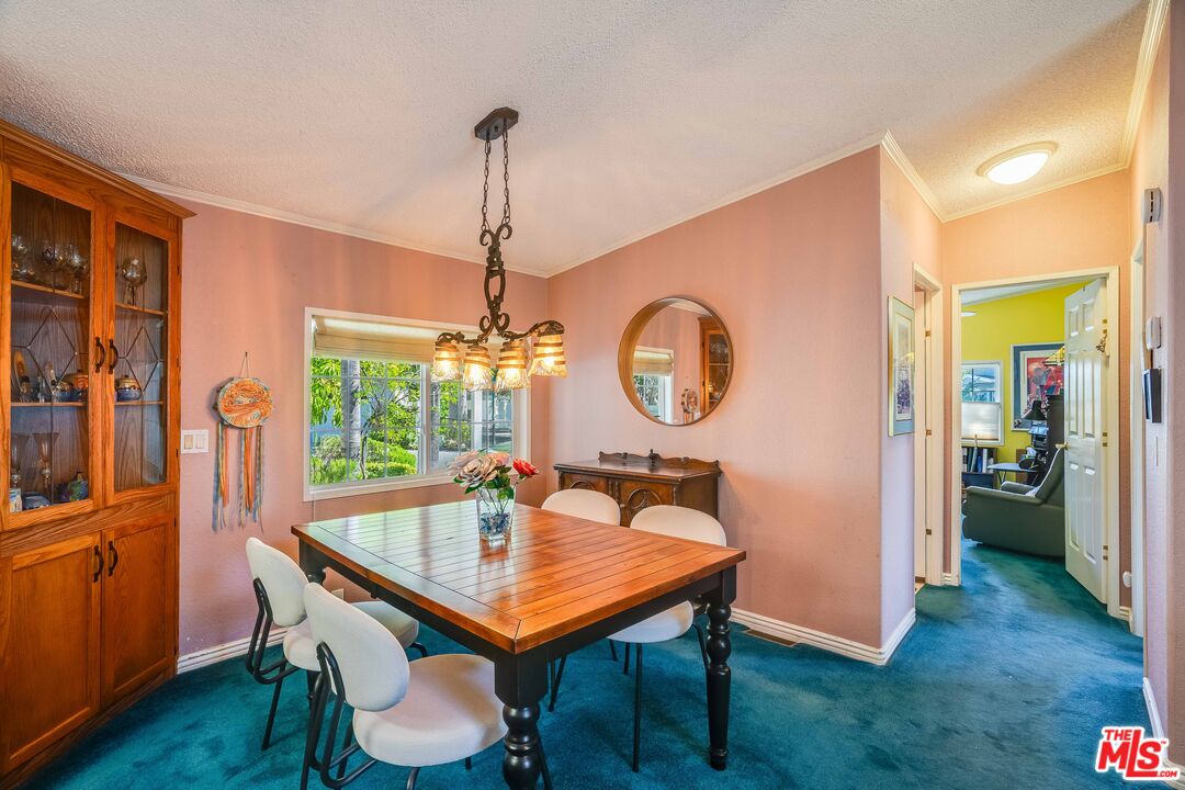 1111 Cherokee Topanga, CA 90290 - Photo 6 of 21 a view of a dining room and a table and chairs
