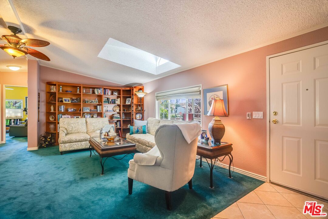 1111 Cherokee Topanga, CA 90290 - Photo 7 of 21 a living room with furniture and a floor to ceiling window