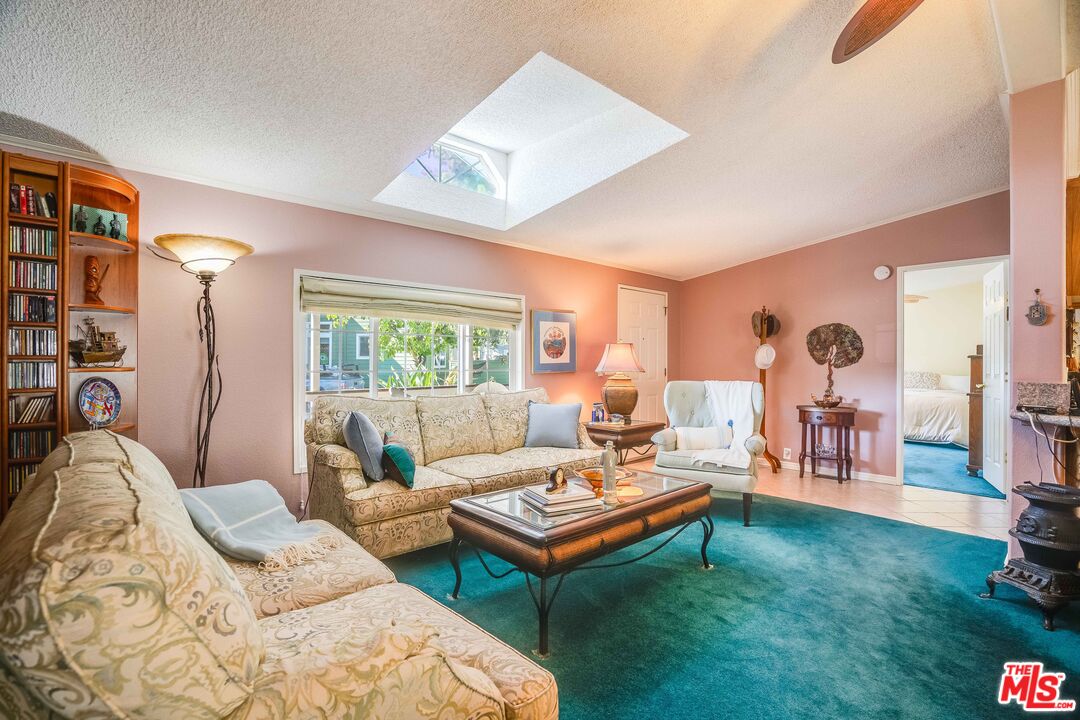 1111 Cherokee Topanga, CA 90290 - Photo 8 of 21 a living room with furniture and a large window
