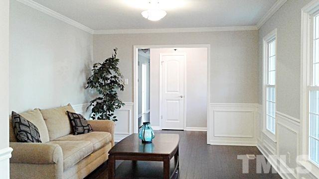 2647 Umstead Road Durham, NC 27712 - Photo 3 of 21 a living room with furniture and a potted plant