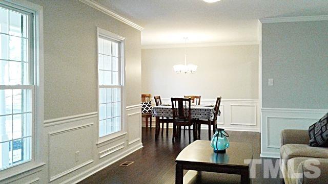 2647 Umstead Road Durham, NC 27712 - Photo 4 of 21 a view of a dining room with furniture and wooden floor