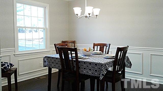 2647 Umstead Road Durham, NC 27712 - Photo 5 of 21 a view of a dining room with furniture and chandelier