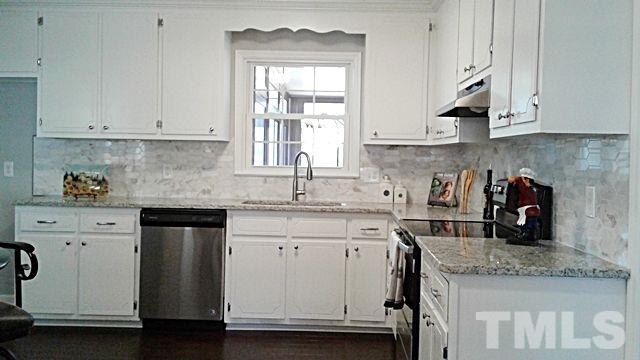 2647 Umstead Road Durham, NC 27712 - Photo 8 of 21 a kitchen with white cabinets and sink