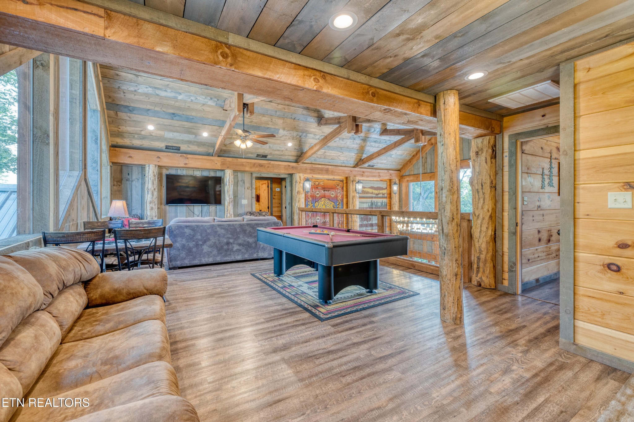809 Pinecrest Way Sevierville, TN 37862 - Photo 32 of 60 a living room with furniture and a wooden floor