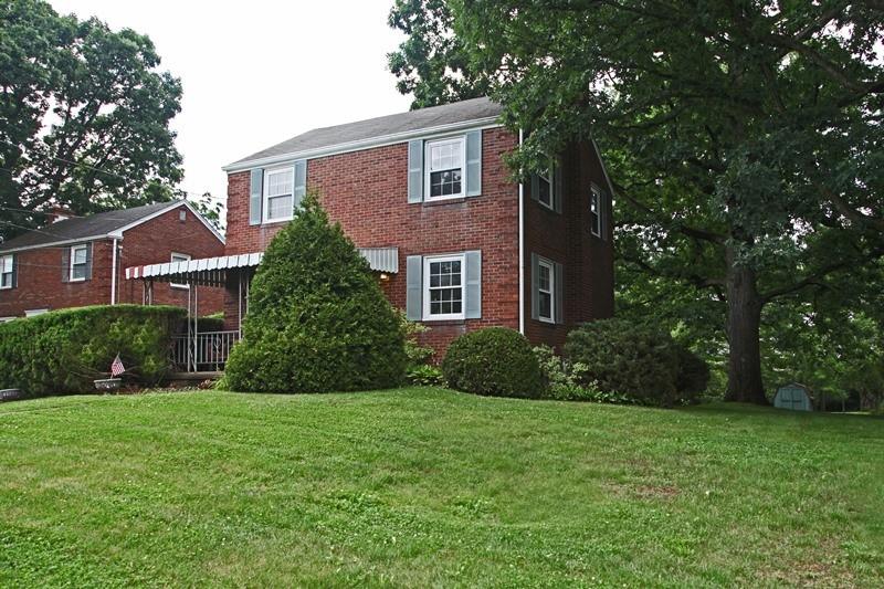8077 Peebles Road Pittsburgh, PA 15237 - Photo 1 of 9 a view of a brick house with a yard