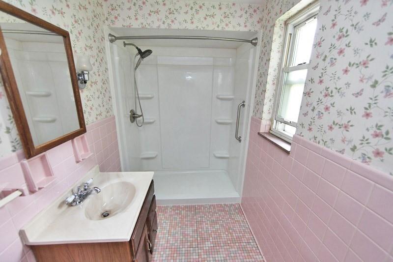 8077 Peebles Road Pittsburgh, PA 15237 - Photo 4 of 9 a bathroom with a sink and a mirror