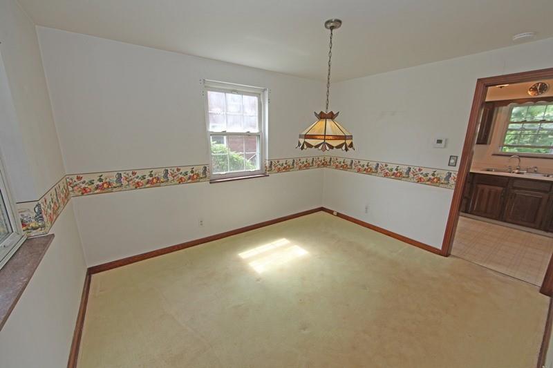 8077 Peebles Road Pittsburgh, PA 15237 - Photo 6 of 9 a view of a room with window wooden floor and furniture