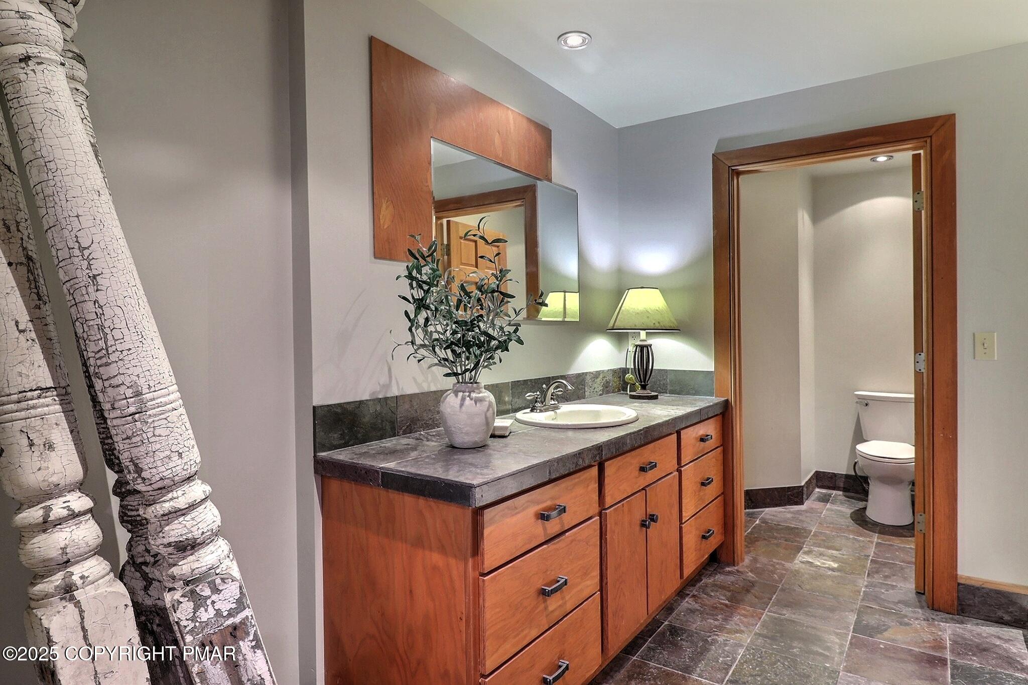 1212 Burger Hollow Road Effort, PA 18330 - Photo 115 of 138 a spacious bathroom with a granite countertop sink and a mirror