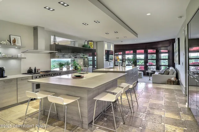 a bedroom with a large bed and a large window