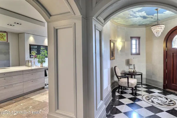 a spacious bathroom with a granite countertop sink and a mirror