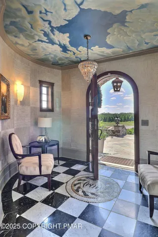 a spacious bathroom with a granite countertop sink and a mirror