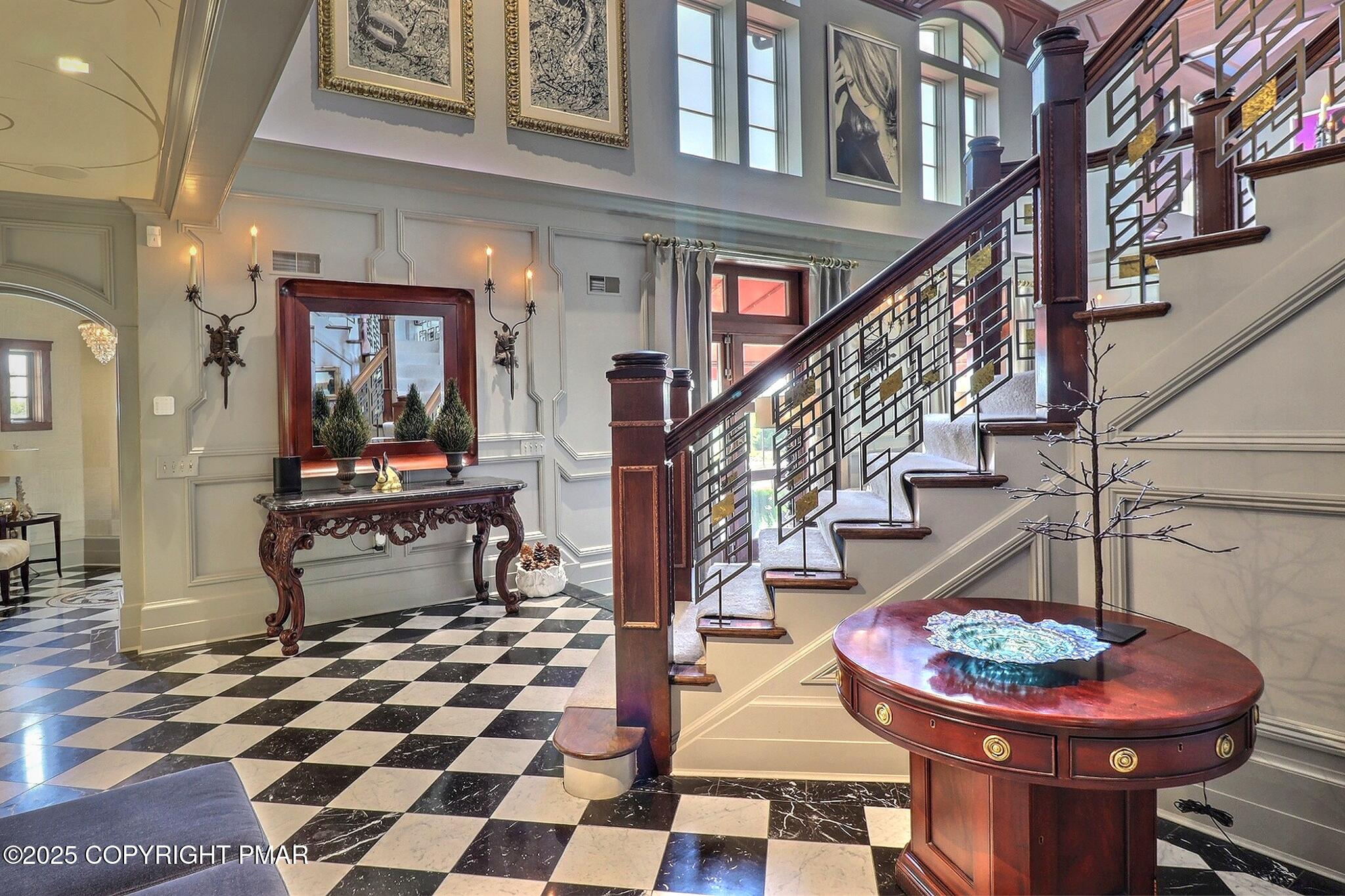 1212 Burger Hollow Road Effort, PA 18330 - Photo 46 of 138 a room with lots of white furniture and wooden floor
