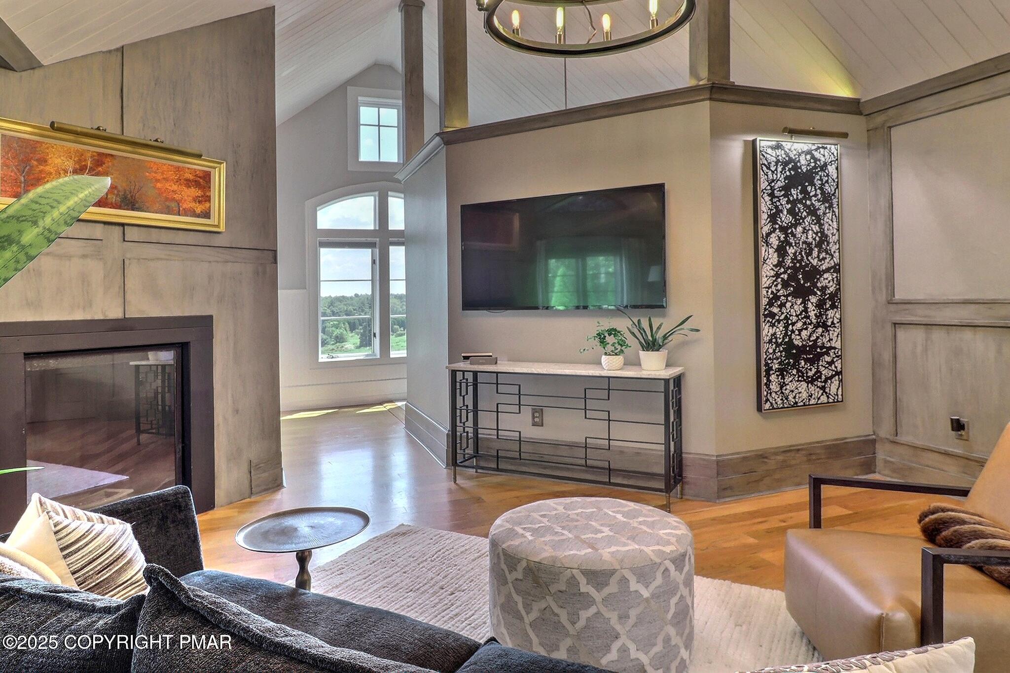 1212 Burger Hollow Road Effort, PA 18330 - Photo 74 of 138 a living room with furniture a fireplace and a flat screen tv
