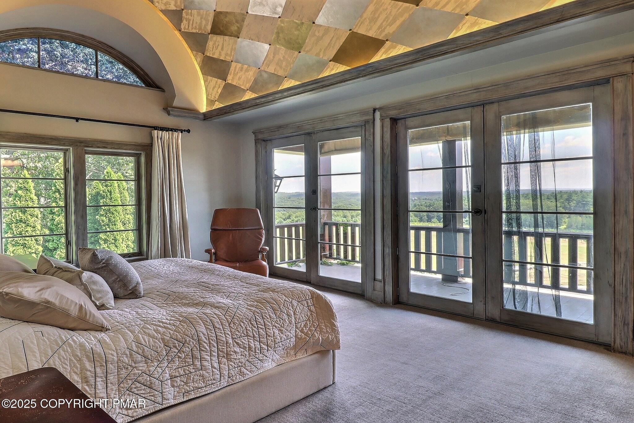 1212 Burger Hollow Road Effort, PA 18330 - Photo 80 of 138 a bedroom with a large bed and a large window