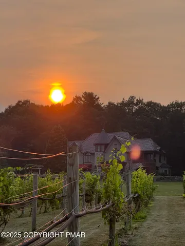 a kitchen with a sink and a large mirror