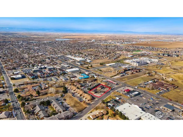 an aerial view of city and mountain
