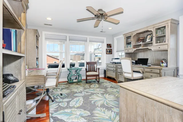 a living room with furniture a rug and a chandelier