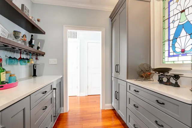 a kitchen with stainless steel appliances a sink and cabinets