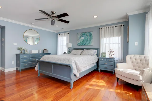 a bedroom with a bed couch and window