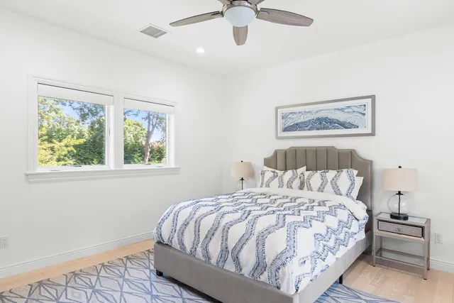 a bathroom with a sink a mirror and a shower