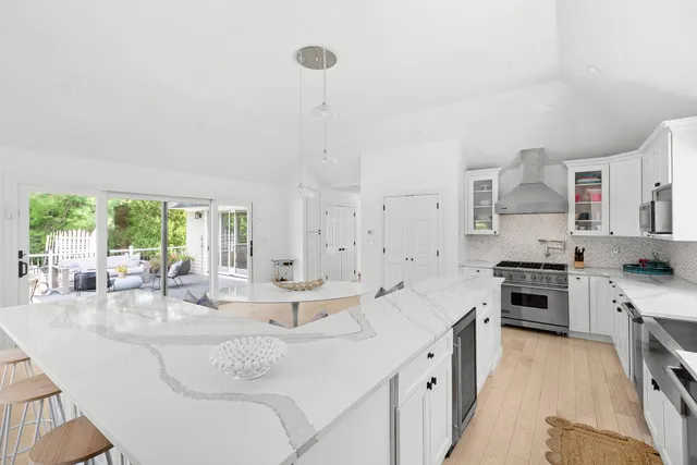 a very nice looking dining room with a table and chairs