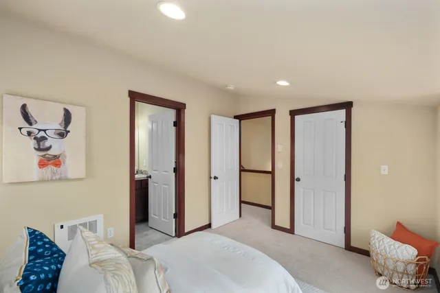 a bathroom with a granite countertop sink toilet a mirror and shower