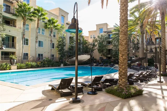 a two chairs sitting in the middle of a yard