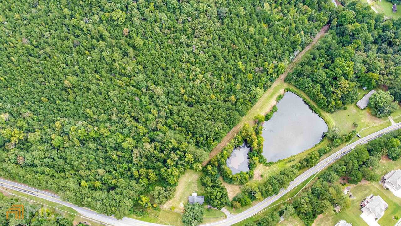 0 Emmett Still Road, Unit TRACT 04 Loganville, GA 30052 - Photo 8 of 23 a view of a yard with a tree