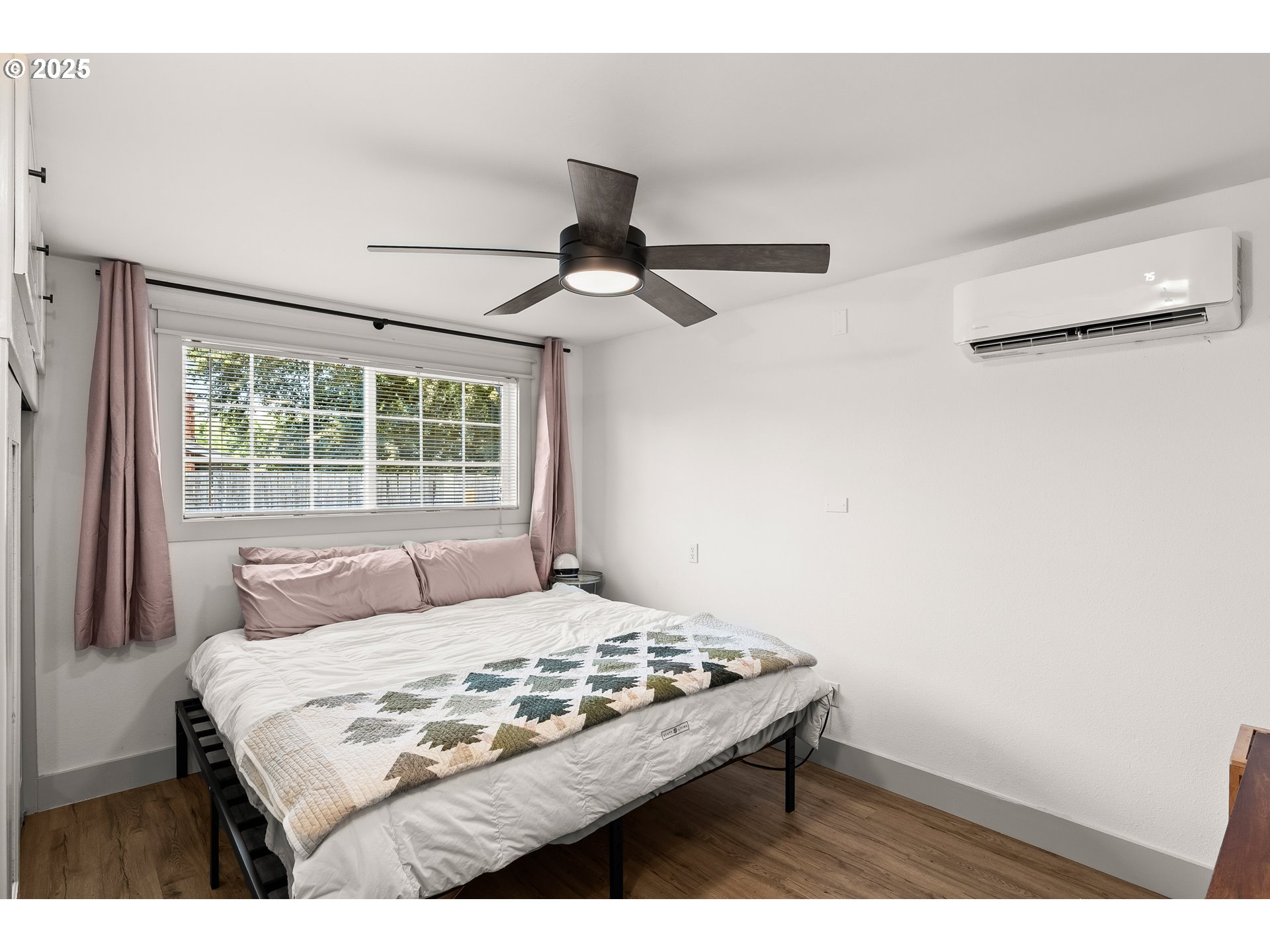 22692 Southwest Highland Drive Sherwood, OR 97140 - Photo 12 of 26 a bedroom with a bed and a window