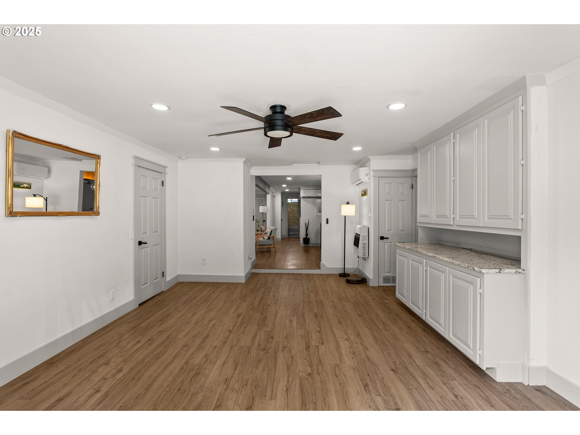 22692 Southwest Highland Drive Sherwood, OR 97140 - Photo 17 of 26 a view of an empty room with a kitchen