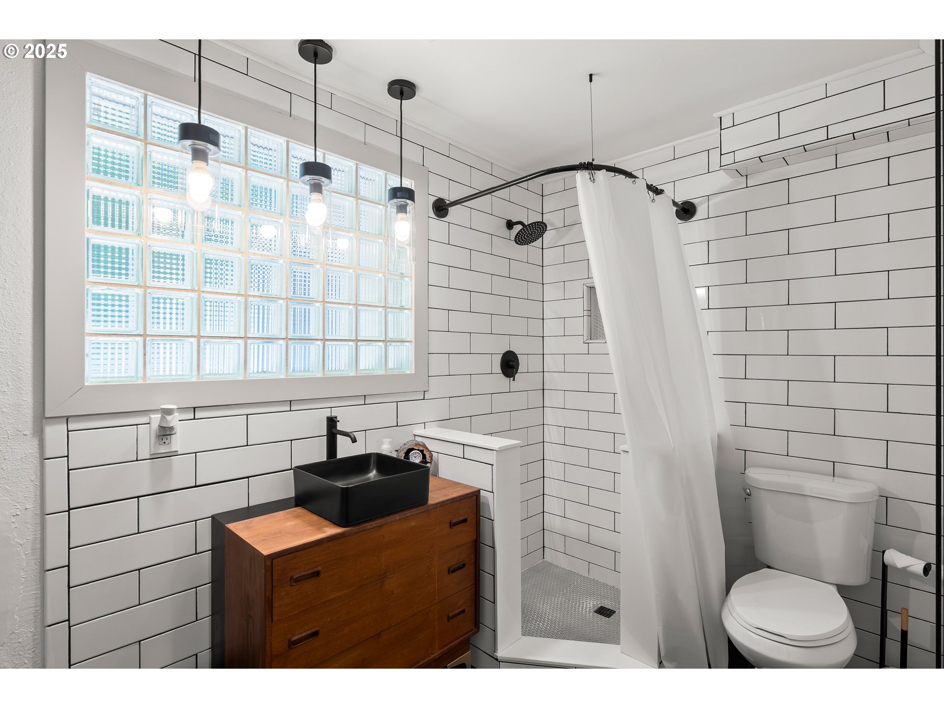 22692 Southwest Highland Drive Sherwood, OR 97140 - Photo 18 of 26 a bathroom with a sink toilet and shower