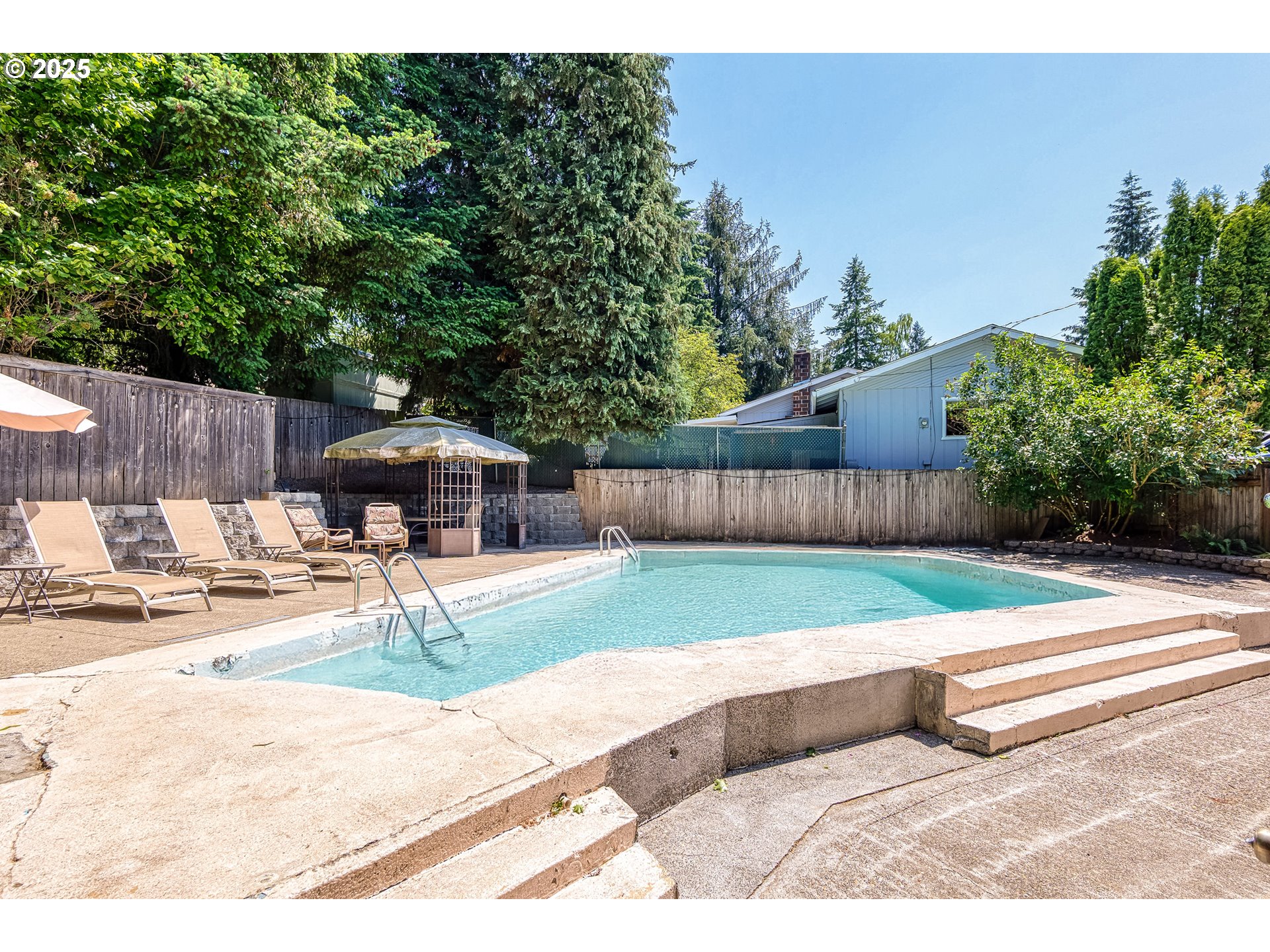 22692 Southwest Highland Drive Sherwood, OR 97140 - Photo 22 of 26 a view of a backyard with sitting area