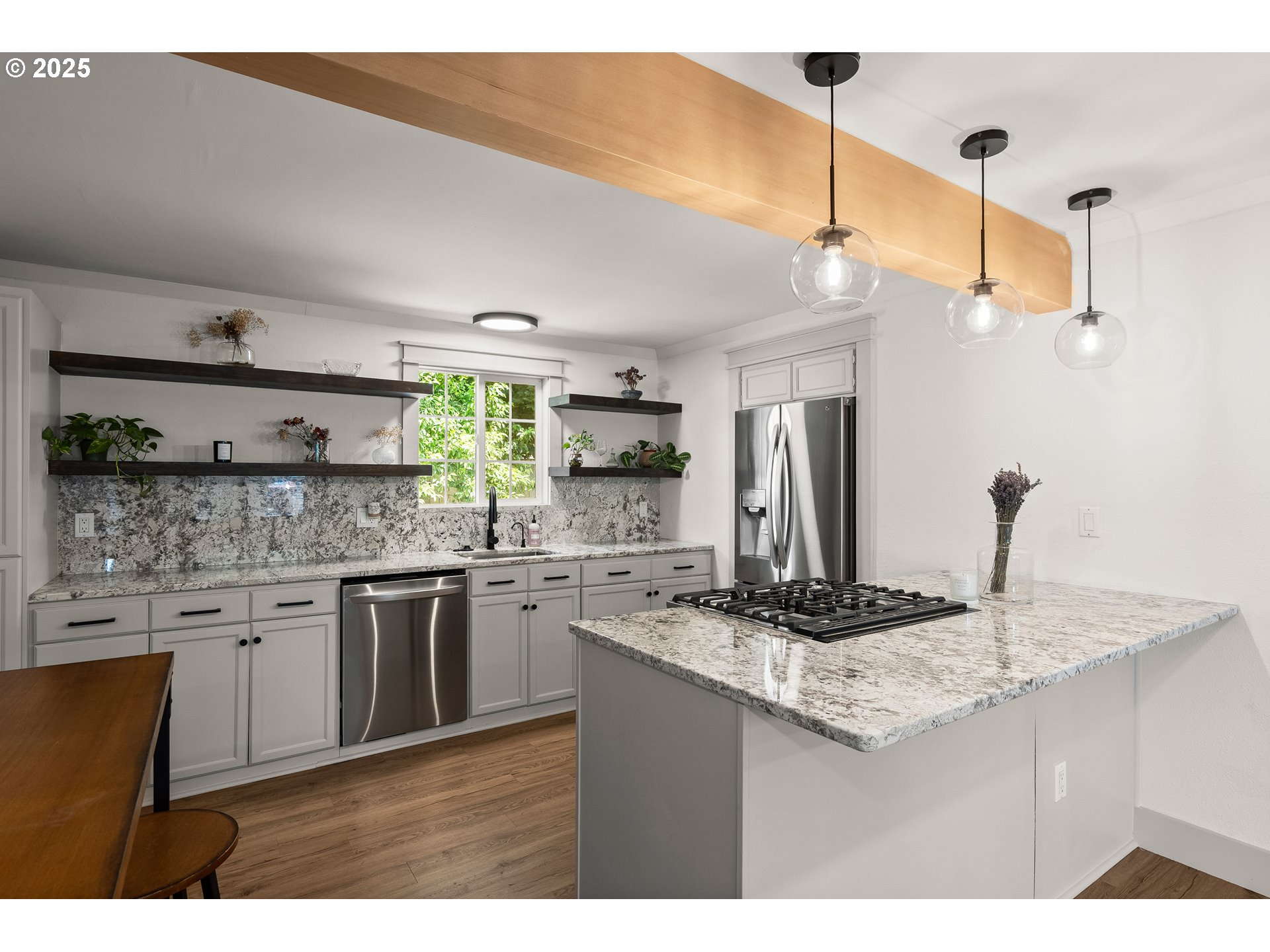 22692 Southwest Highland Drive Sherwood, OR 97140 - Photo 3 of 26 a kitchen with stainless steel appliances granite countertop a sink stove and refrigerator