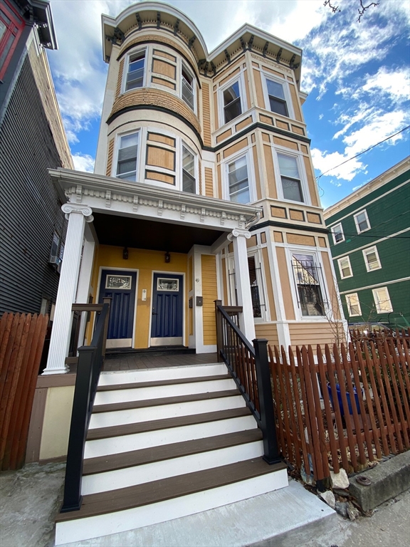 49 Copeland Street, Unit 1 Boston, MA 02119 - Photo 2 of 2 a front view of a multi story residential apartment building