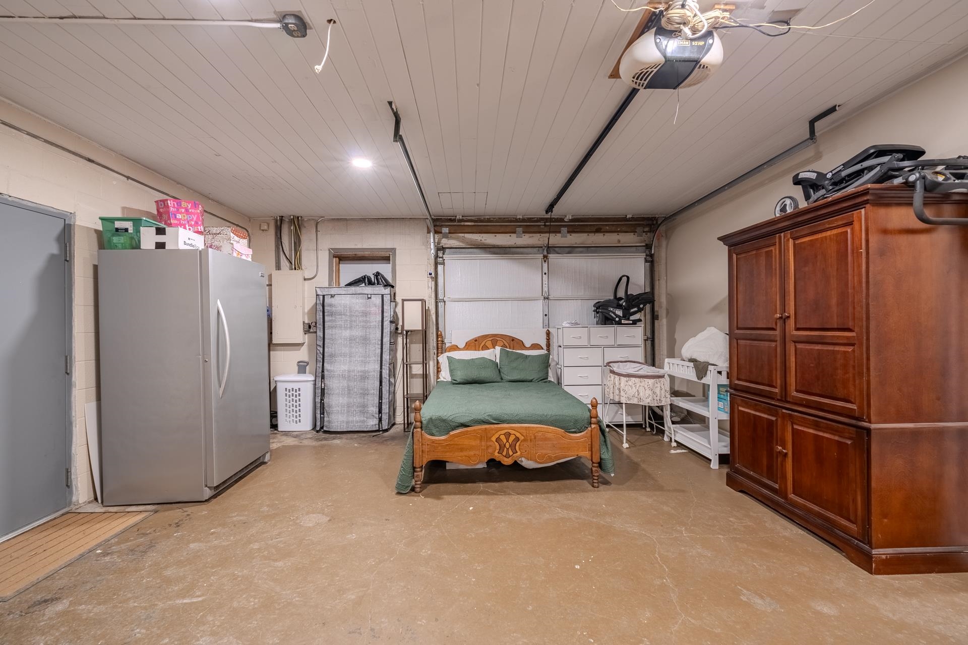 390 Woods Road Adamsville, TN 38310 - Photo 12 of 40 a bedroom with bed and cabinets