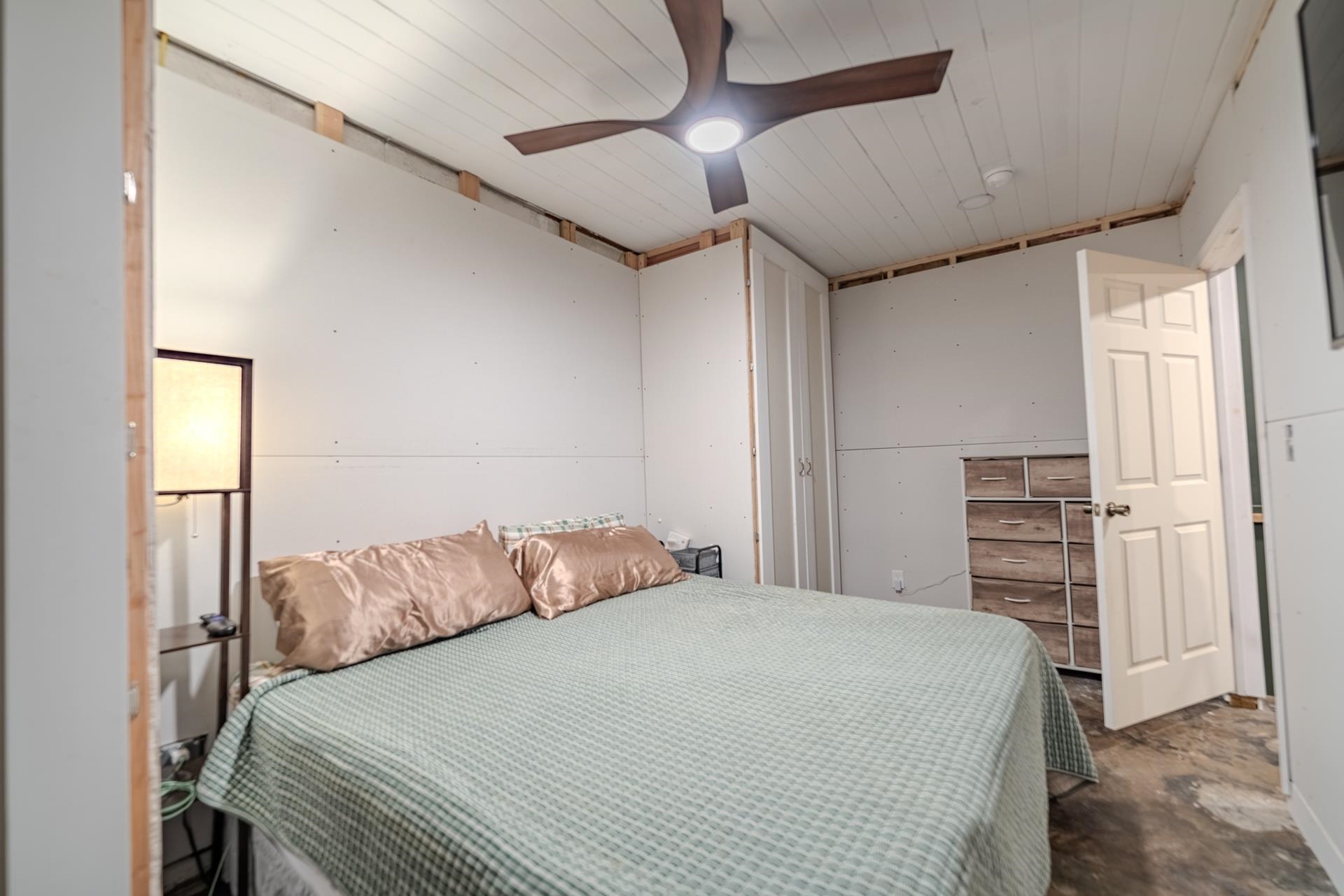 390 Woods Road Adamsville, TN 38310 - Photo 13 of 40 a bedroom with a bed and a ceiling fan