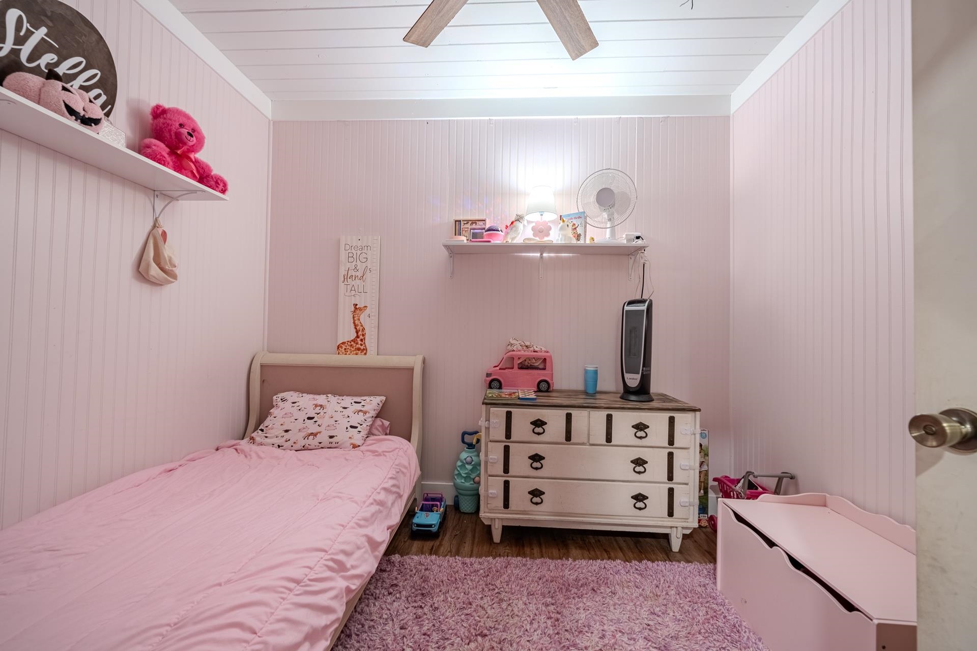 390 Woods Road Adamsville, TN 38310 - Photo 17 of 40 a bedroom with a bed and dresser