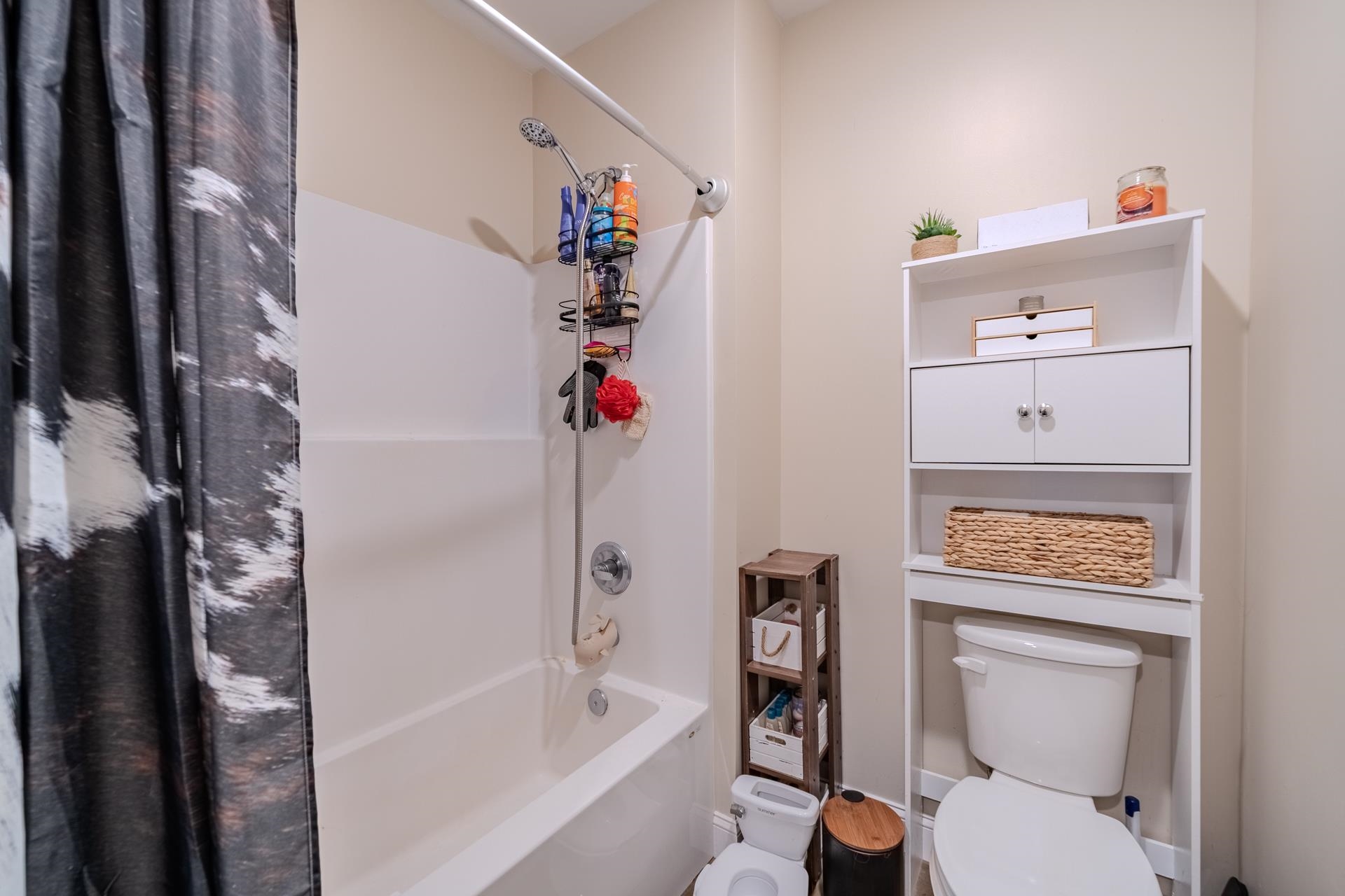 390 Woods Road Adamsville, TN 38310 - Photo 20 of 40 a bathroom with a bath tub a sink and a toilet