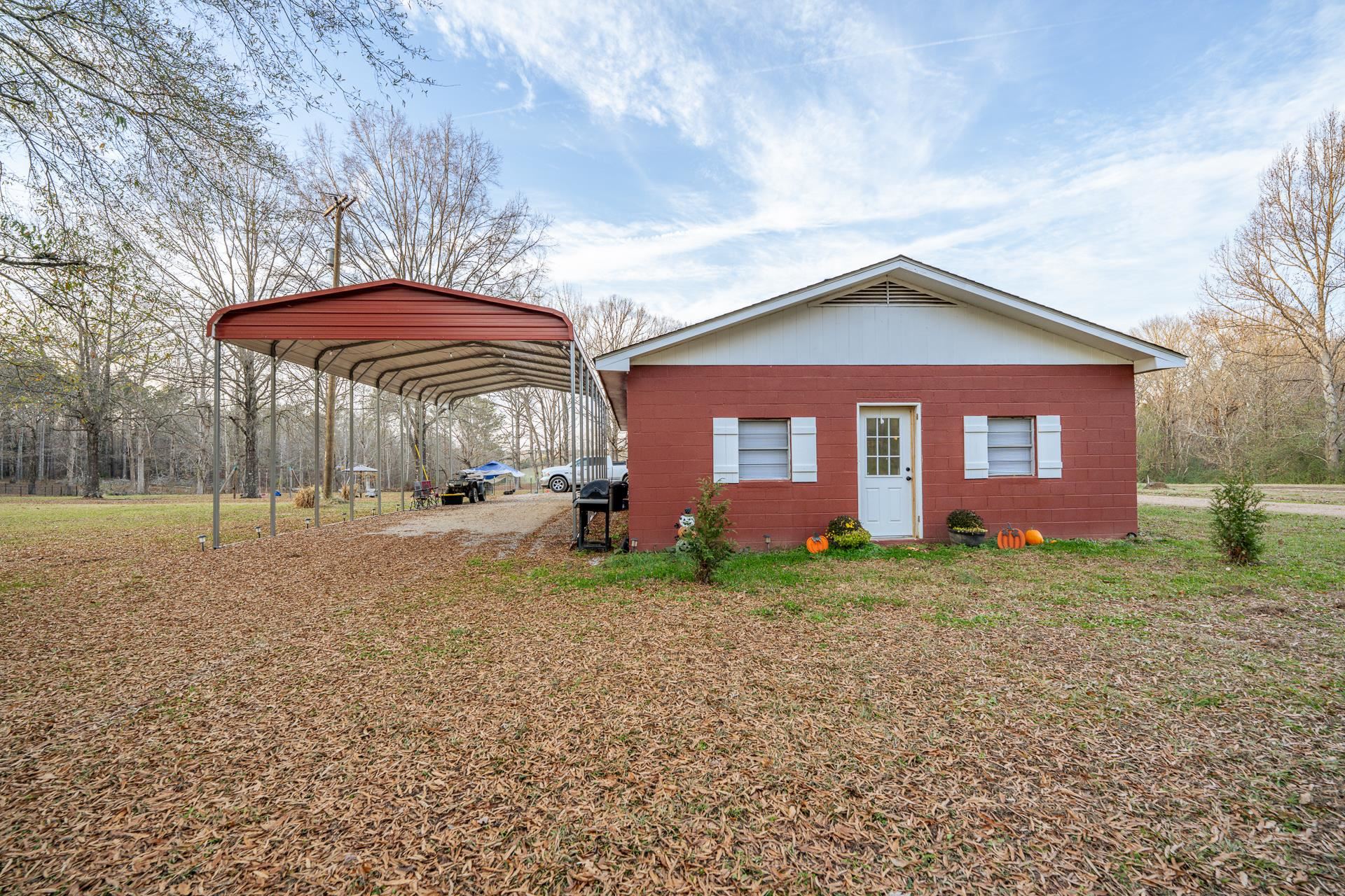 390 Woods Road Adamsville, TN 38310 - Photo 40 of 40 a view of a house with a yard