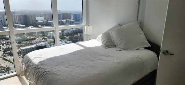 a bed room with a bed and a night stand