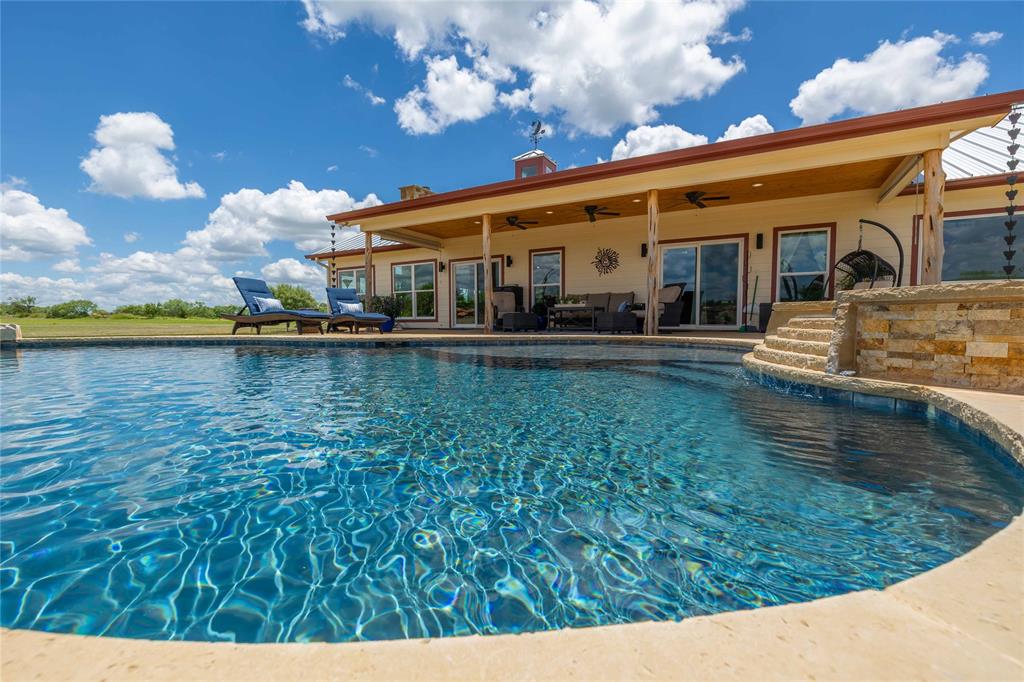 1010 Fm 583 Street West Rising Star, TX 76471 - Photo 10 of 40 a front view of a house with swimming pool having outdoor seating