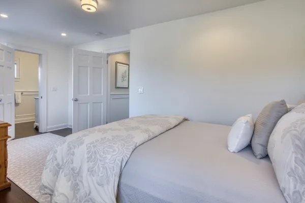 a bedroom with a bed and a walk in closet