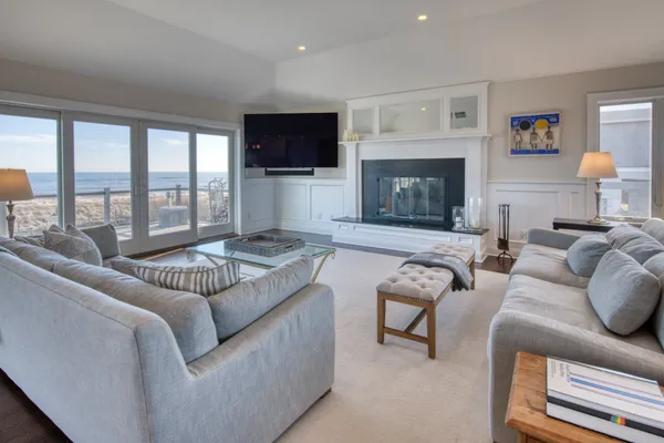 a living room with furniture fireplace and a flat screen tv