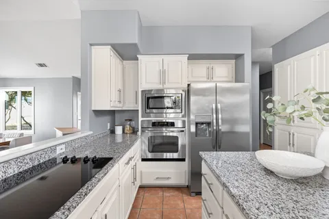 a view of a livingroom with furniture and a workspace
