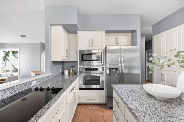 a view of a livingroom with furniture and a workspace