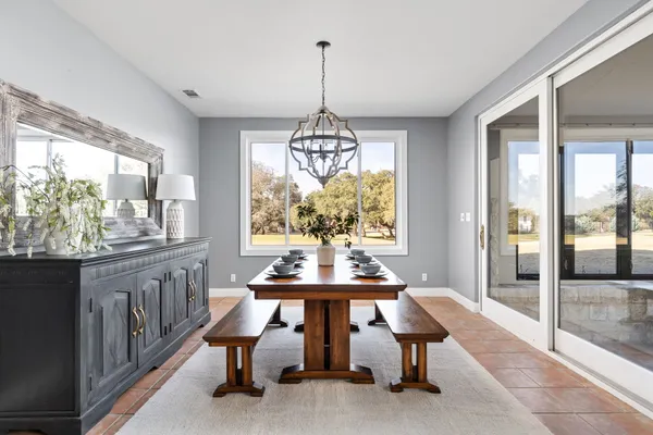 a bedroom with a bed and a large window with mirror